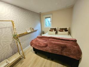 Holiday home with private Sauna on the Veluwe with cold water Tub bath