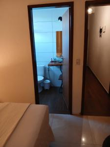 Suíte confortável com ar condicionado 101