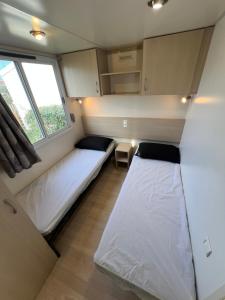 Campings Les mobil homes de NOLY, 1 Place adulte Reserve Africaine de Sigean gratuite : photos des chambres