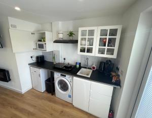 Self-contained studio with folding down Bed