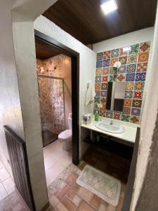 Casa com Piscina e com rio cristalino em Boiçucanga