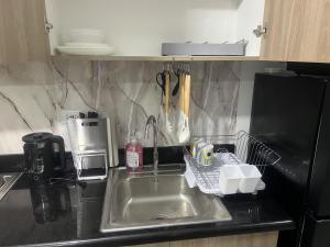 Shore 2 Residences Executive Suite by JMS