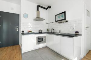 Klimatyczne i Nowoczesne Studio Very Berry w Poznaniu by Noclegi Renters