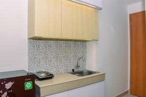 Cozy Studio with Single Bed at Evenciio Margonda Apartment By Travelio