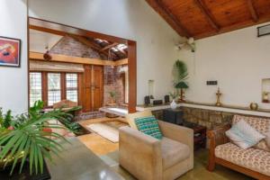 Kerala Style Villa by JadeCapsAC4BHKFishpond