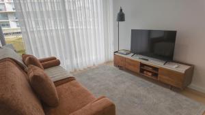 Flat with garage and balcony with view to a garden