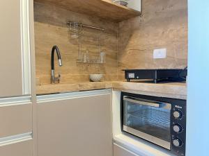 Studio completo e aconchegante no centro