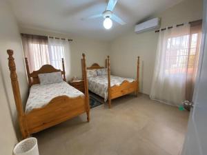 2BR & 2 WR ocean view Suite at Villa Costa Verde in Playa Cofresi, Puerto Plata, with a pool, big veranda, and a rooftop terrace