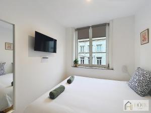 Appartements Petit Cocon - Confort & Moderne : photos des chambres