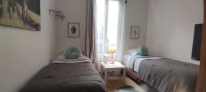 Sejours chez l'habitant PARIS AUTHENTIC HOUSE Metro 14 Station Hopital Bicetre, RER B Gentilly : photos des chambres