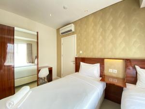 Artistic & Private 2BR Apartment at Parahyangan Residence By Travelio