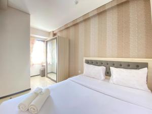 Cozy and Serene 2BR Apartment at Parahyangan Residence By Travelio