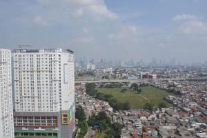 Cozy Stay and Comfort 2BR at Bassura Apartment By Travelio