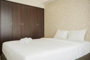 Well Designed and Cozy 2BR Apartment Branz BSD City By Travelio