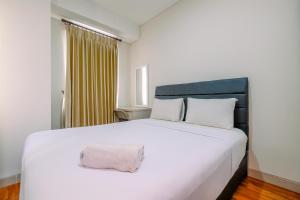 Modern Look and Homey 2BR Transpark Cibubur Apartment near Mall By Travelio