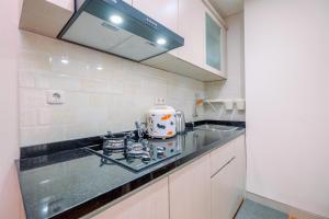 Modern Look and Homey 2BR Transpark Cibubur Apartment near Mall By Travelio