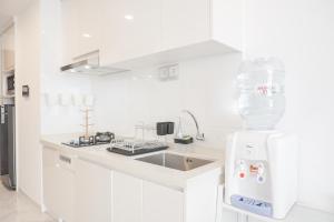 Homey and High Floor 2BR at Sky House BSD Apartment By Travelio