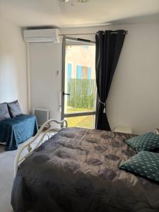 Appartements Appartement climatise avec jardin 4 personnes : photos des chambres