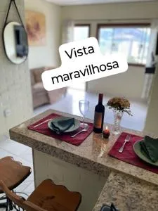 Flat com vista espetacular 2 banheiros-área central-cozinha completa-AR- casais - grupos ou familias ou empresas - Marilac