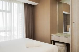 Fully Furnished with Comfortable 3BR Apartment at M-Town Residence By Travelio