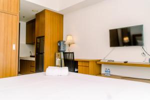 Cozy Living Studio Apartment at Scientia Residence By Travelio