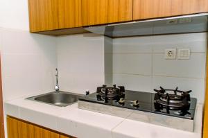 Cozy Living Studio Apartment at Scientia Residence By Travelio