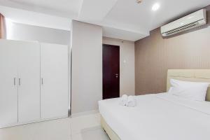 Stunning and Spacious 2BR Brooklyn Alam Sutera Apartment By Travelio