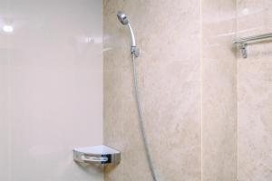 Minimalist Studio Room at Transpark Cibubur Apartment near Shopping Center By Travelio