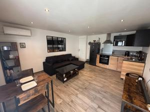 Appartement en rez-de-jardin avec terrasse privative