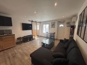 Appartement en rez-de-jardin avec terrasse privative