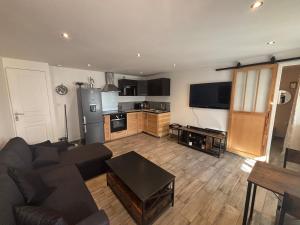 Appartement en rez-de-jardin avec terrasse privative