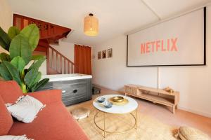 Appartements Oasis Cachee - Jacuzzi et cinema : photos des chambres