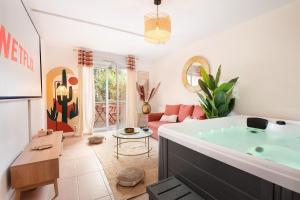 Appartements Oasis Cachee - Jacuzzi et cinema : photos des chambres