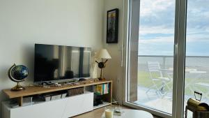 Appartements Face a la mer immense : photos des chambres