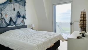 Appartements Face a la mer immense : photos des chambres