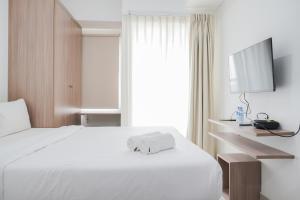 Simple and Cozy Living Studio at Serpong Garden Apartment By Travelio