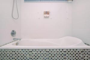 Comfort 2BR + Extra Room at Sudirman Tower Condominium Apartment By Travelio