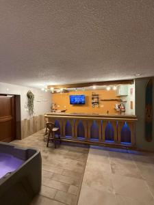 Appartements Le Savoyard - Bar & Jacuzzi : photos des chambres