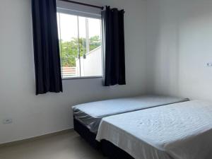 Casa a 150m da praia com piscina e churrasqueira