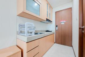 Warm and Simply Look Studio Apartment at B Residence By Travelio