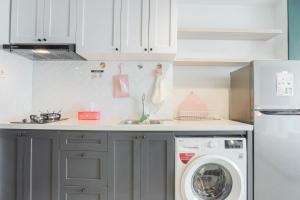 Minimalist Studio Room with City View at West Vista Apartment By Travelio