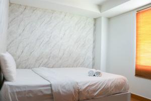 Warm and Homey 2BR at Sentraland Cengkareng Apartment By Travelio