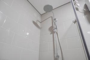 Nice and Comfort 1BR at Citralake Suites Apartment By Travelio