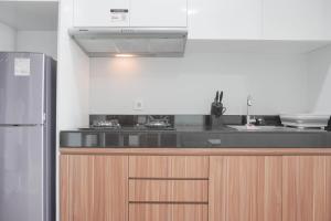 Nice and Comfort 1BR at Citralake Suites Apartment By Travelio