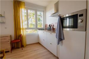 Appartements Le Nid Colore T2 petit dej- offert : photos des chambres