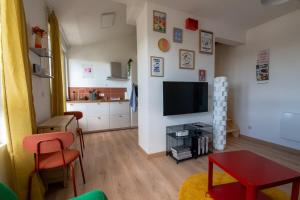 Appartements Le Nid Colore T2 petit dej- offert : photos des chambres
