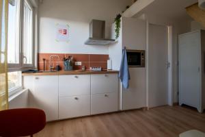 Appartements Le Nid Colore T2 petit dej- offert : photos des chambres