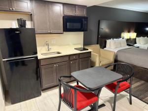 King Suite with One King and Two Double Beds - Non-Smoking room in Quality Inn & Suites Banquet Center