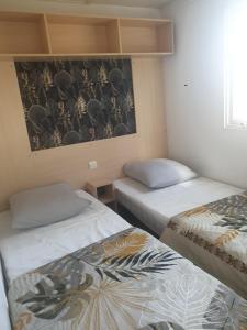 Campings Mobil home 4 personnes avec clim : photos des chambres