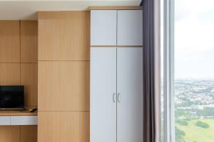 Gala by TwoSpaces Studio at TreePark Apartment
